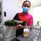 flight attendent pouring champagne